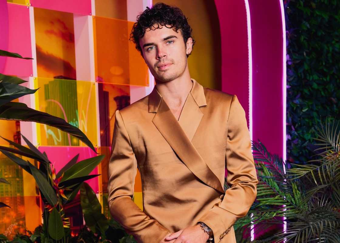 Nic Vansteenberghe poses in a golden suit. Nic Vansteenberghe poses in a golden suit.