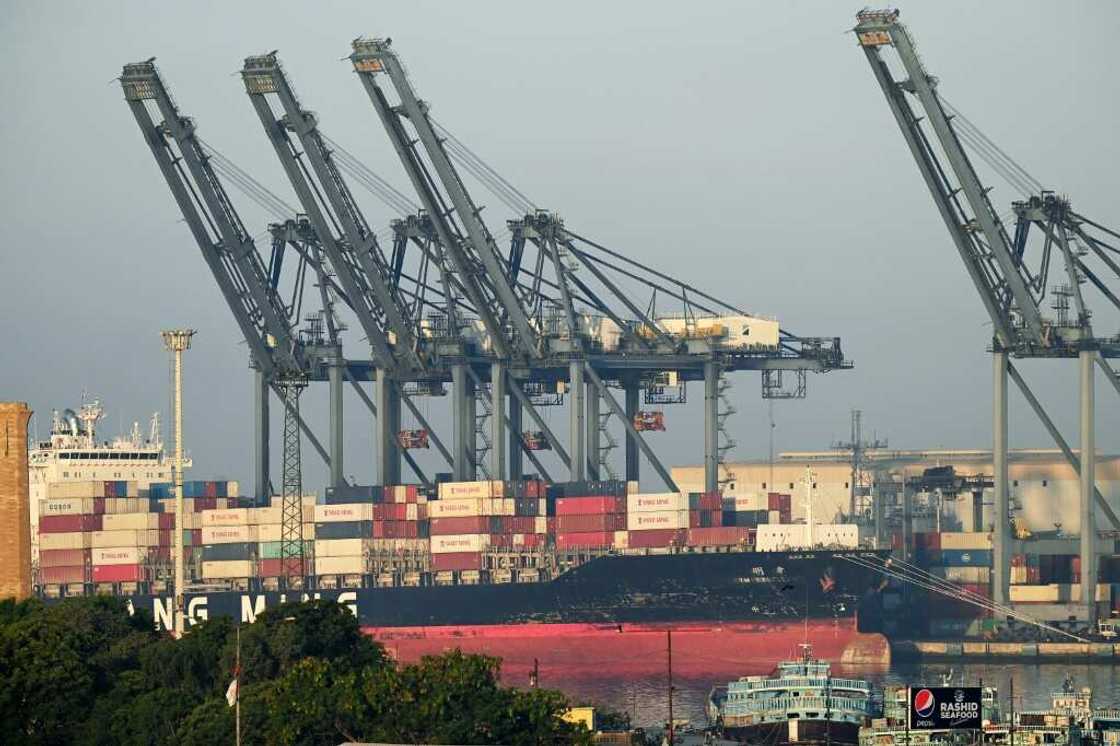 Shipping containers are seen stacked on a ship at port in Karachi on April 6, 2023. Pakistan has only enough forex reserves to pay for a month of imports Shipping containers are seen stacked on a ship at port in Karachi on April 6, 2023. Pakistan has only enough forex reserves to pay for a month of imports