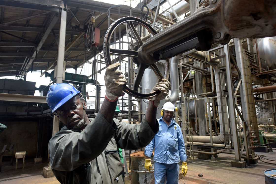 A worker controls the valve at the new Port Harcourt refinery. A worker controls the valve at the new Port Harcourt refinery.