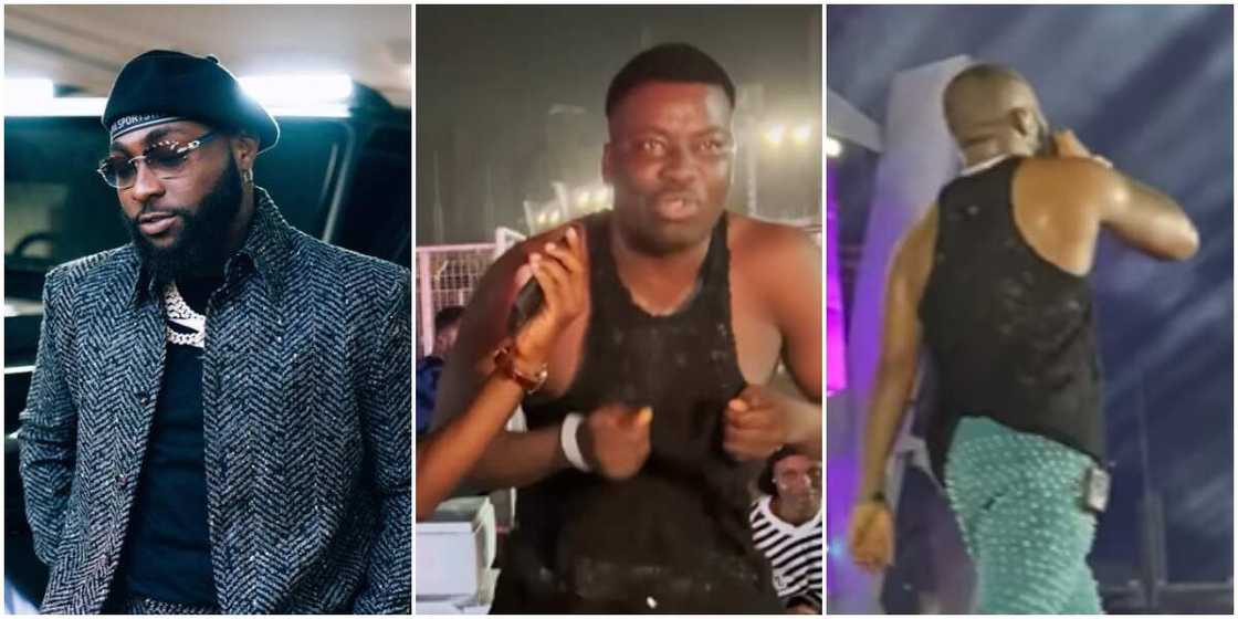 Davido, Fan grabs Davido's singlet at Timeless concert, Davido on stage at Timeless concert Davido, Fan grabs Davido's singlet at Timeless concert, Davido on stage at Timeless concert