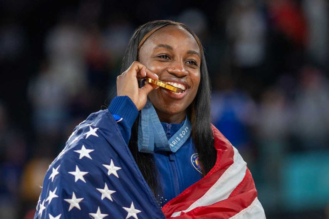 Jackie Young #13 of Team United States as the team celebrates with their gold medals