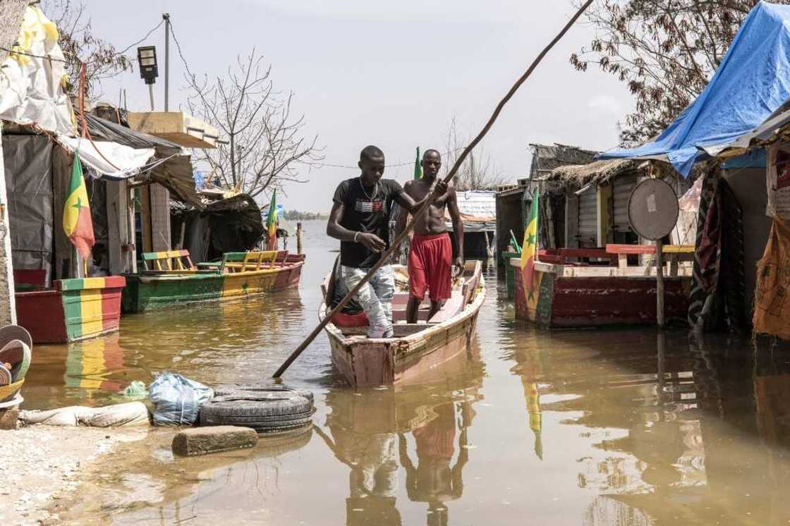 Senegal's Lake Retba, or Pink Lake, experienced a dramatic rise in water levels during this year's rainy season Senegal's Lake Retba, or Pink Lake, experienced a dramatic rise in water levels during this year's rainy season