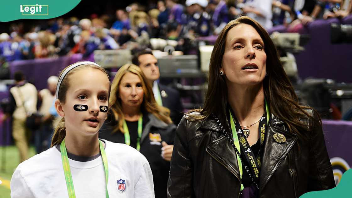 Alison Harbaugh and Ingrid Harbaugh standing on the field