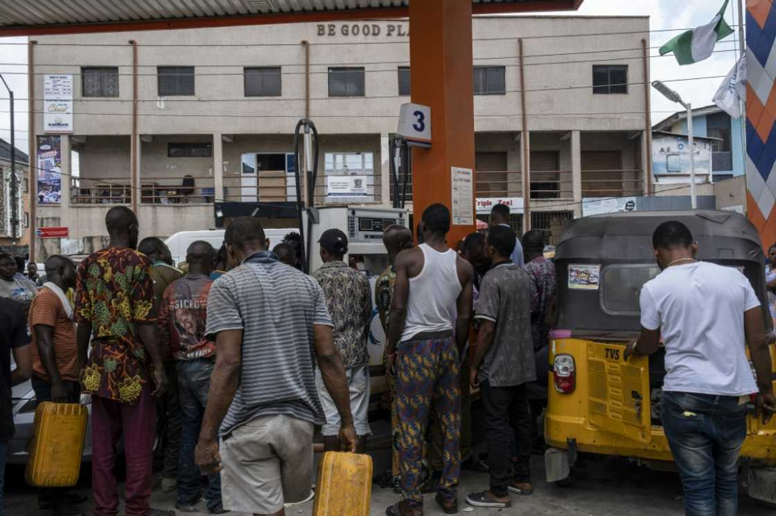 Nigerians grappled with widespread fuel scarcities and a hike in pump prices Nigerians grappled with widespread fuel scarcities and a hike in pump prices