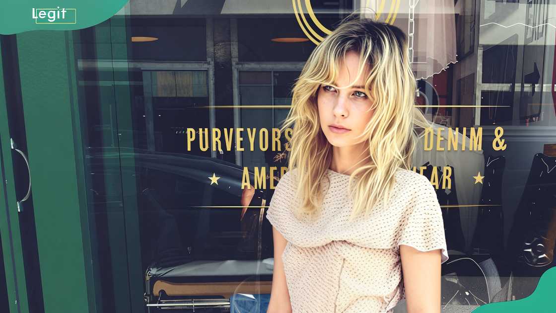 Daveigh Chase standing in front of a storefront window Daveigh Chase standing in front of a storefront window
