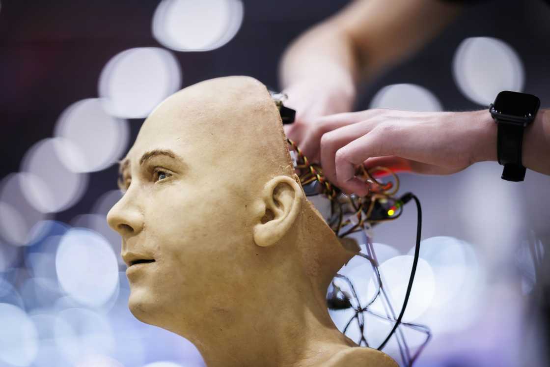 A man works on the electronics of Jules, a humanoid robot from Hanson Robotics using AI, at the recent International Telecommunication Union AI for Good Global Summit in Geneva A man works on the electronics of Jules, a humanoid robot from Hanson Robotics using AI, at the recent International Telecommunication Union AI for Good Global Summit in Geneva