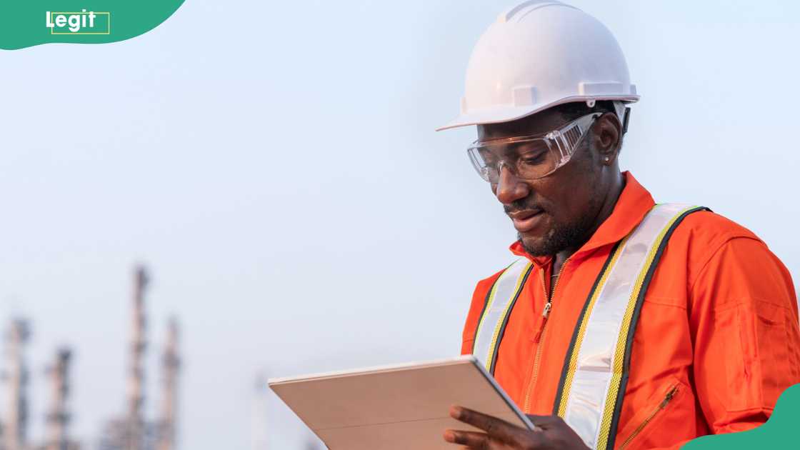 A man working at an oil and gas plant. A man working at an oil and gas plant.