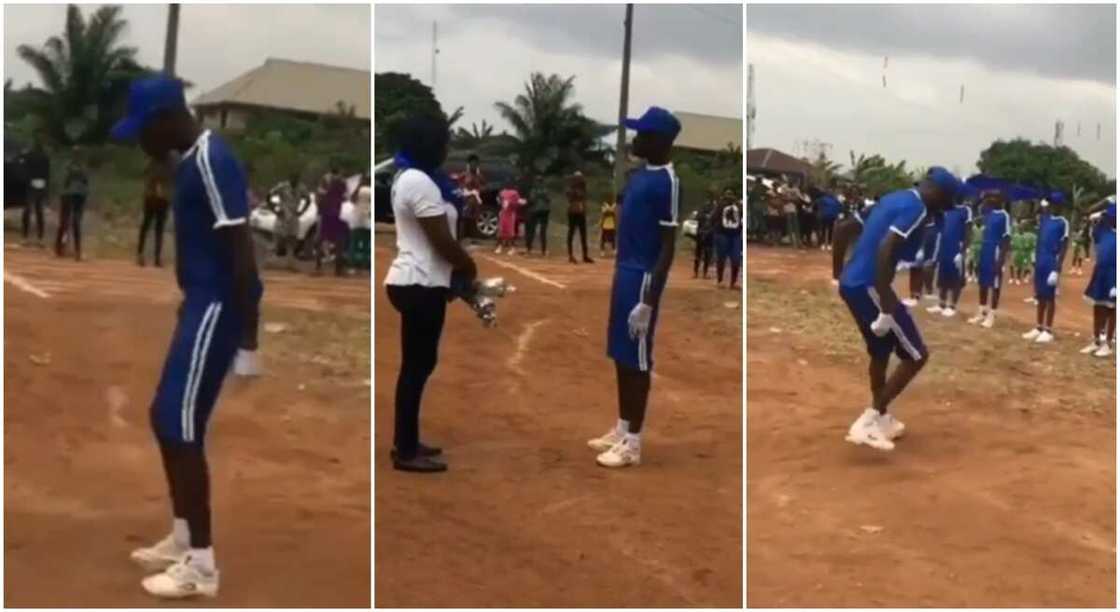 Boy from blue house uses his march-past to cause a stir during inter-house sports competition.