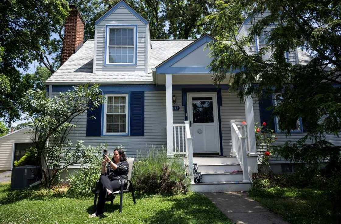 Julie McMurtry joins a zoom call with co-workers from her home in Arlington, Virginia Julie McMurtry joins a zoom call with co-workers from her home in Arlington, Virginia