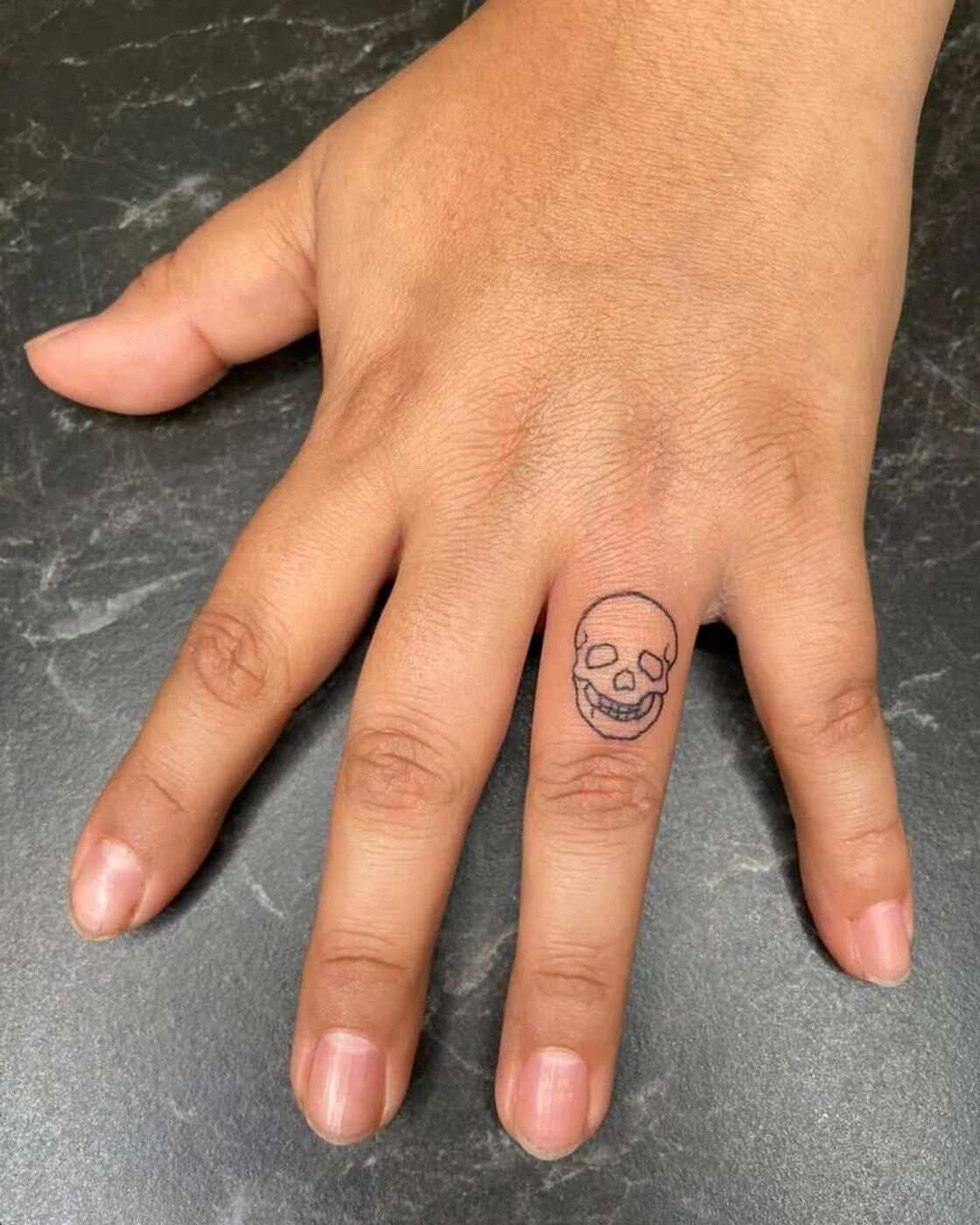 ring finger tattoos