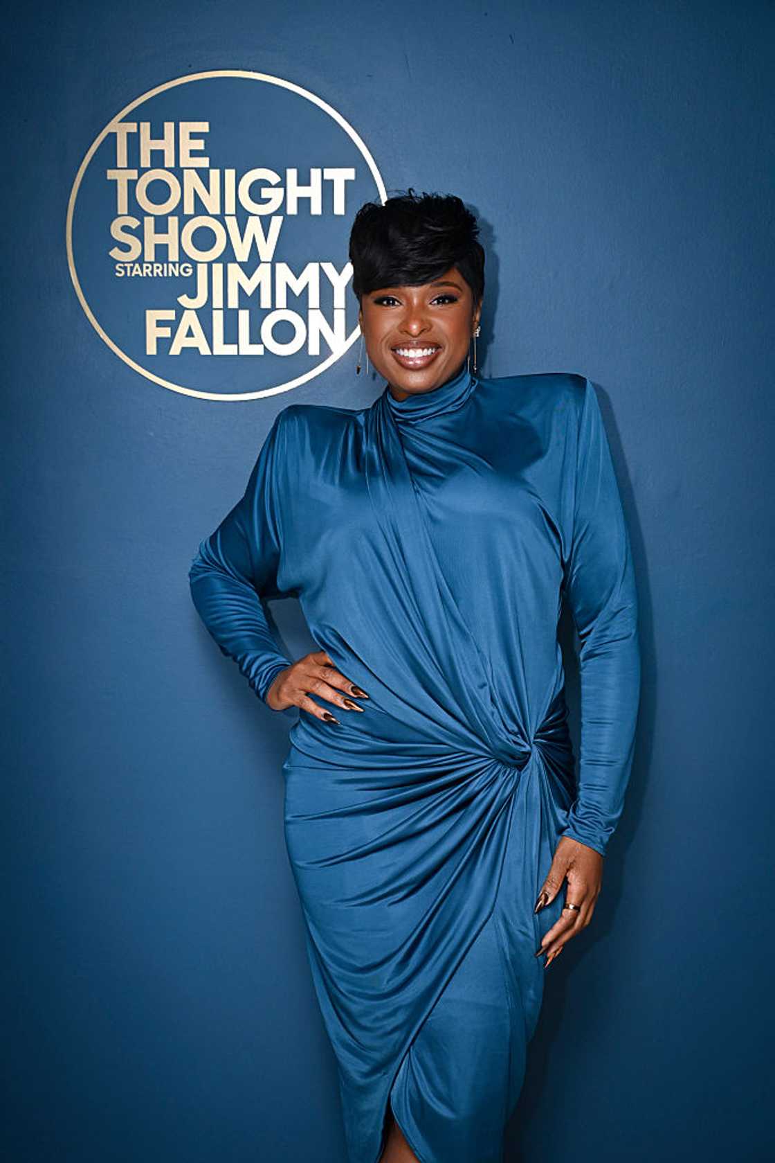 Jennifer Hudson in a fitted teal draped dress, smiling backstage at The Tonight Show Starring Jimmy Fallon in New York, 2026 Jennifer Hudson in a fitted teal draped dress, smiling backstage at The Tonight Show Starring Jimmy Fallon in New York, 2026