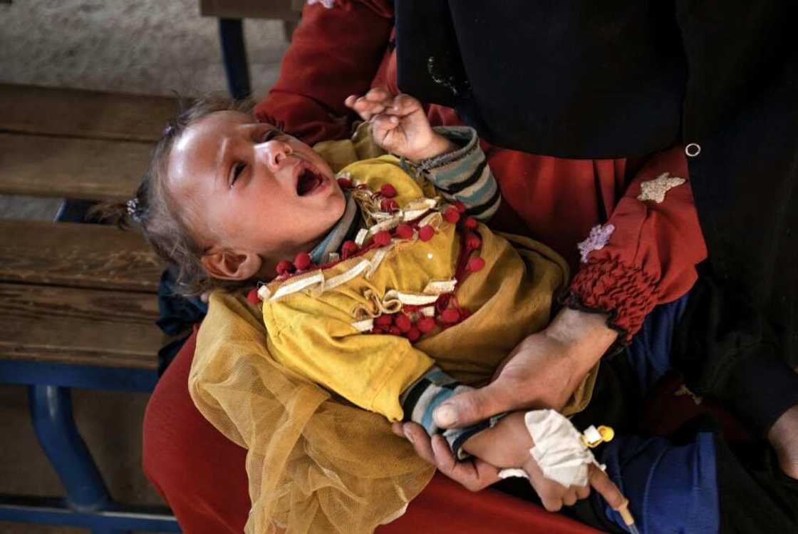 A child suffering from cholera receives treatment at the Al-Kasrah hospital in Syria's eastern province of Deir Ezzor A child suffering from cholera receives treatment at the Al-Kasrah hospital in Syria's eastern province of Deir Ezzor
