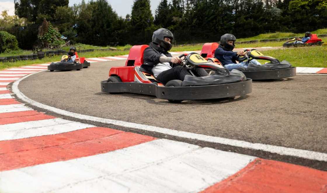 A group of friends racing in go-karts