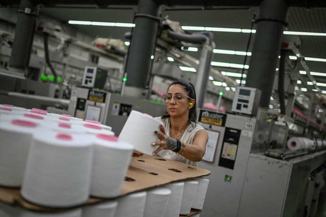 A Riopele employee piles thread rolls at the state-of-the-art factory in Vila Nova de Famalicao A Riopele employee piles thread rolls at the state-of-the-art factory in Vila Nova de Famalicao