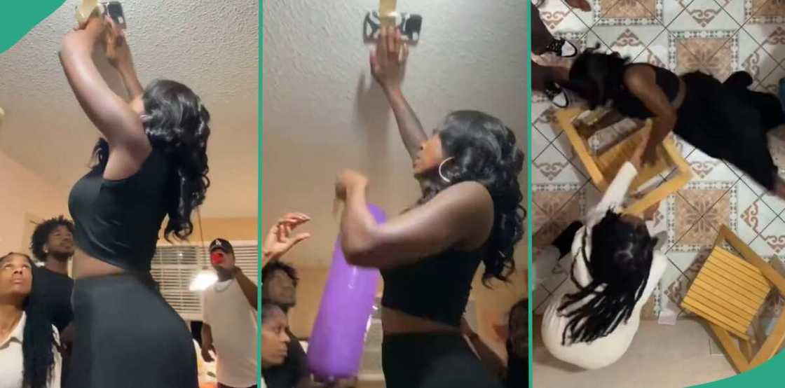 Lady falls while attempting ceiling challenge. Lady falls while attempting ceiling challenge.