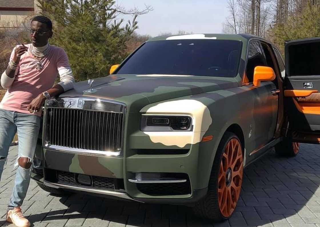 Young Dolph posing with his camouflage wrapped Rolls-Royce Cullinam Young Dolph posing with his camouflage wrapped Rolls-Royce Cullinam