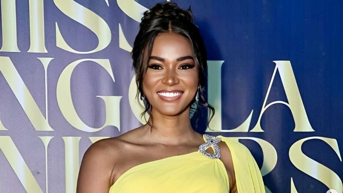 Leila Lopes pictured in a yellow outfit on the red carpet of a 2024 Miss Universe ceremony