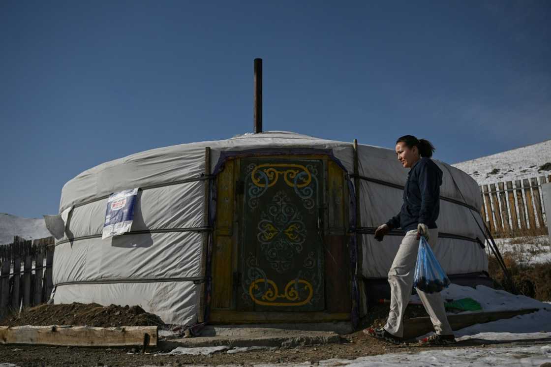 Ger dwellings sprawl in the city's suburbs, where many people use coal burners Ger dwellings sprawl in the city's suburbs, where many people use coal burners