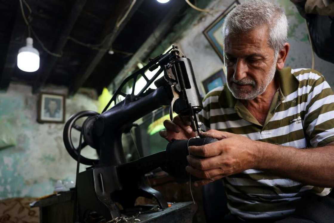 Lebanese cobbler Walid al-Suri says demand has increased since Lebanon's economic collpase, but 'there are no profits' Lebanese cobbler Walid al-Suri says demand has increased since Lebanon's economic collpase, but 'there are no profits'