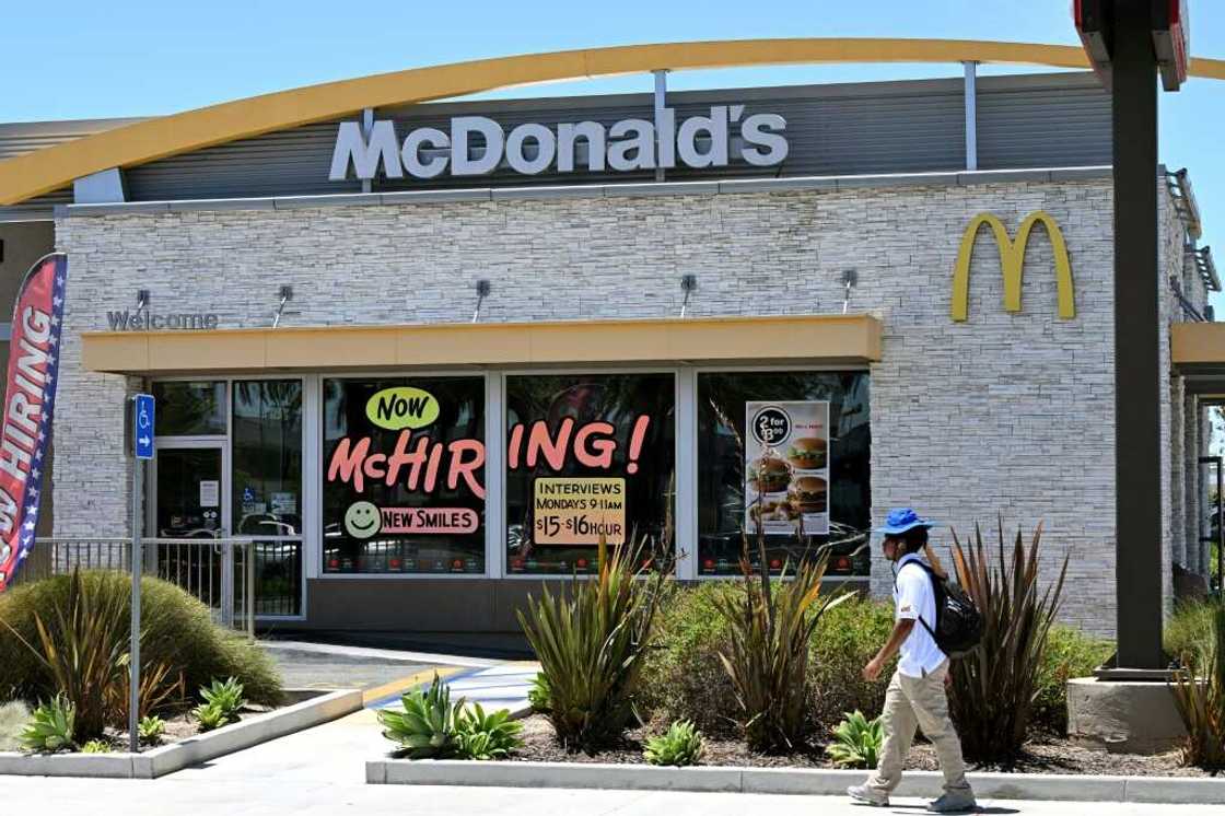 A McDonald's restaurant in Garden Grove, California, seen on July 8, 2022, with a big 'Now McHIRING!' sign in the window