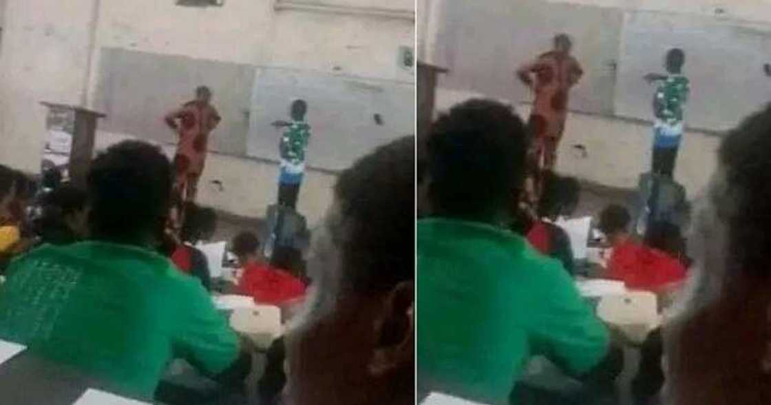 Year one student corrects his lecturer during a class Year one student corrects his lecturer during a class