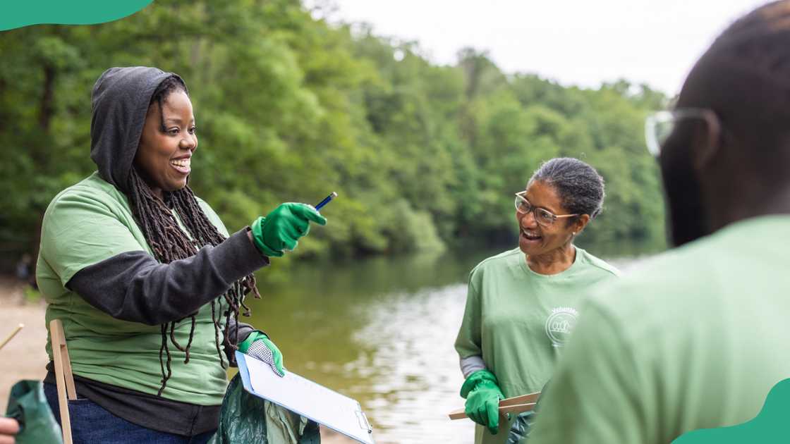 An extension worker talks to a group of people