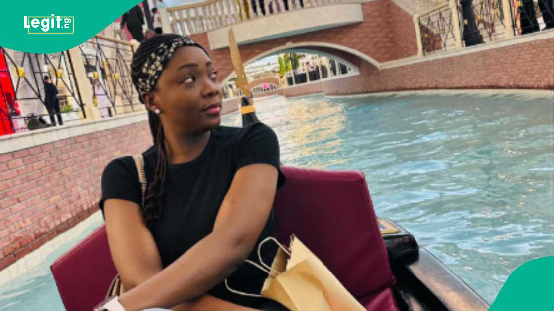 A Nigerian lady celebrates after being featured in an Indian music video.