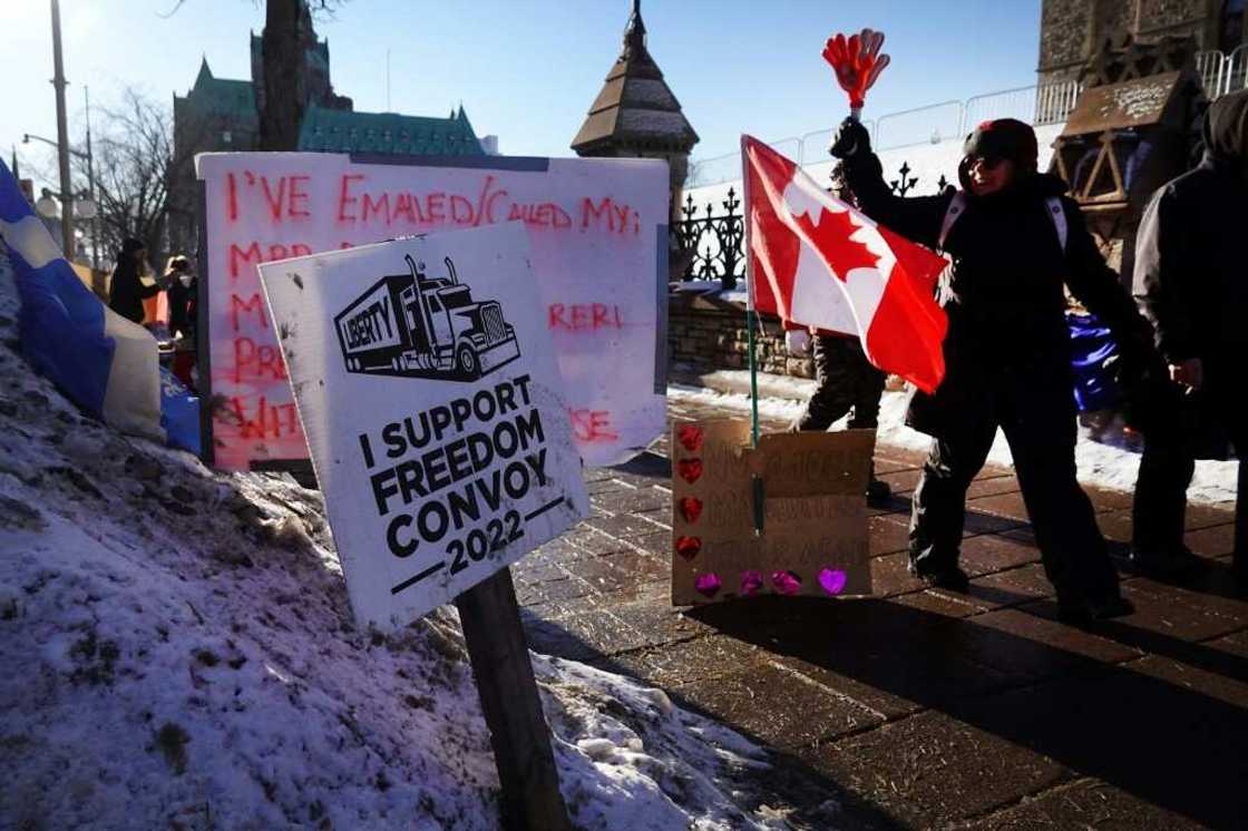 Truck drivers and their "Freedom Convoy" supporters block streets during an anti vaccine mandate protest near the Parliament Buildings on February 15, 2022 in Ottawa, Canada Truck drivers and their "Freedom Convoy" supporters block streets during an anti vaccine mandate protest near the Parliament Buildings on February 15, 2022 in Ottawa, Canada