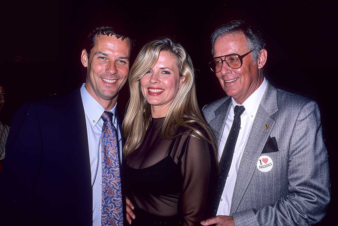 Kim Basinger (L), brother Skip (C), and father Donald (R) pose at the Mann Village & Bruin Theatres