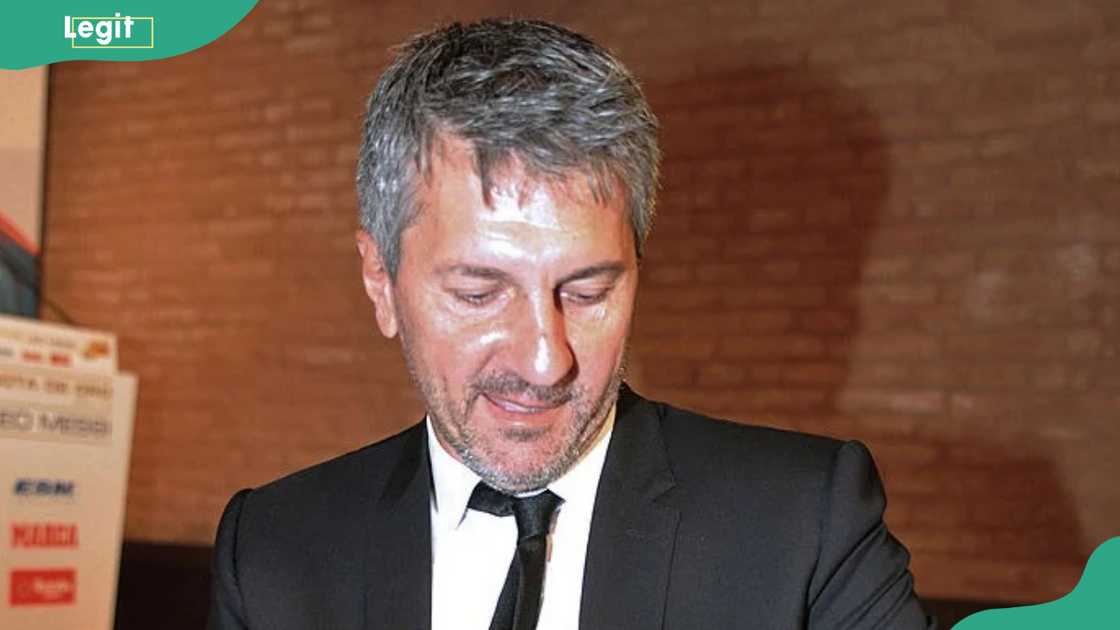 Lionel Messi's father Jorge Horario Messi holding the Golden Bootee for his future grandson