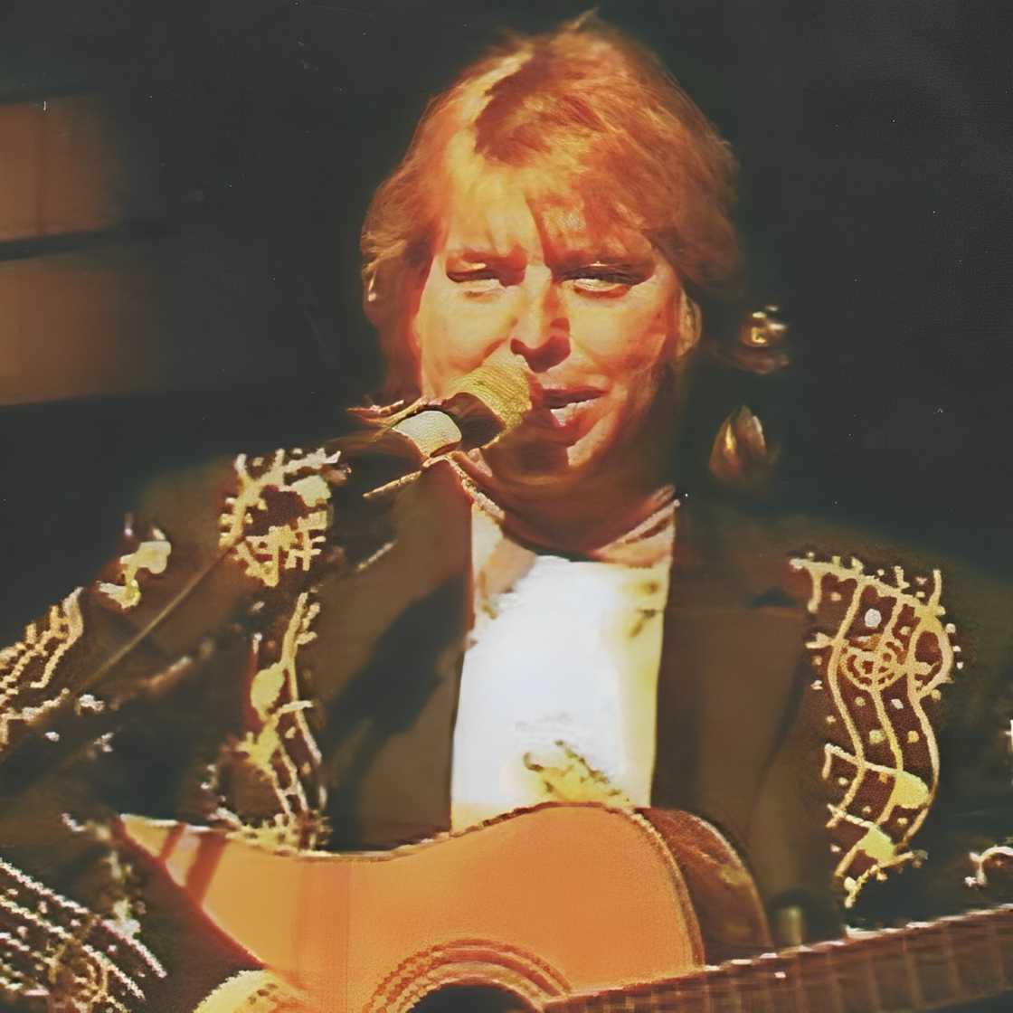 Ron Gaddis playing a guitar