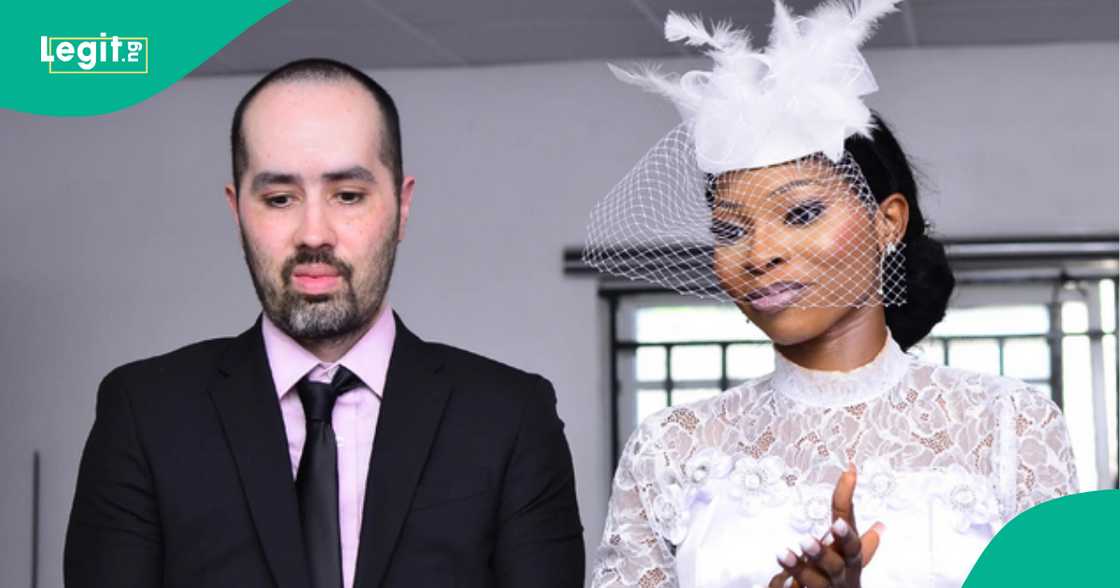 White man's facial expression after marrying Nigerian lady raises concern on social media White man's facial expression after marrying Nigerian lady raises concern on social media
