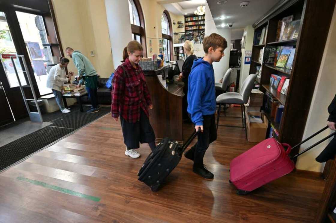 People haul piles of Russian-language books, sometimes by the suitcase or car-load, for recycling People haul piles of Russian-language books, sometimes by the suitcase or car-load, for recycling