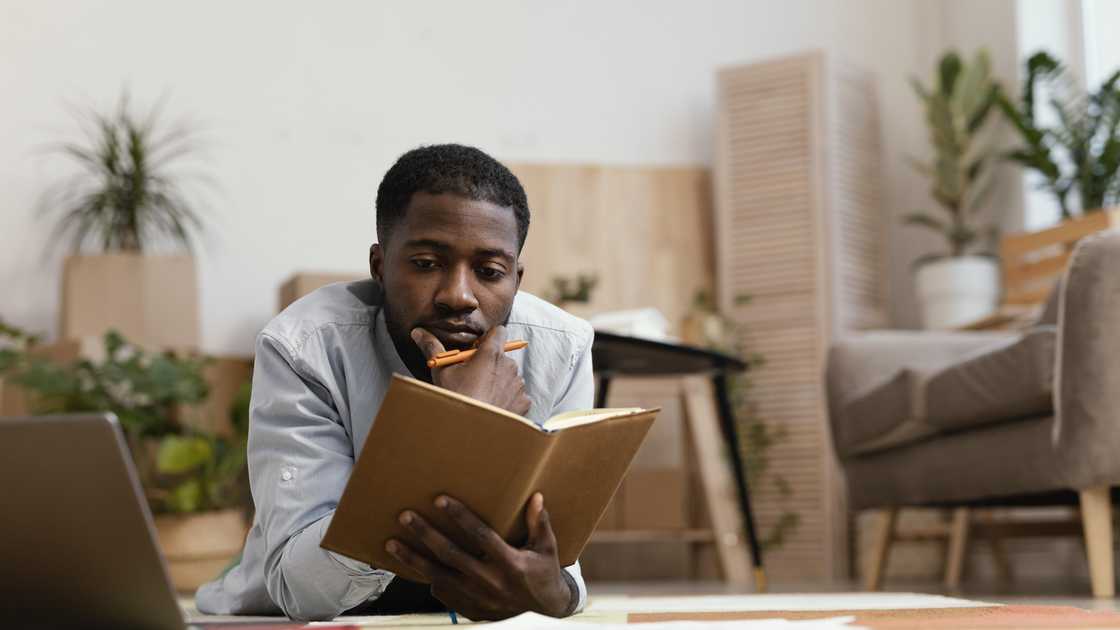 A man reading a book A man reading a book
