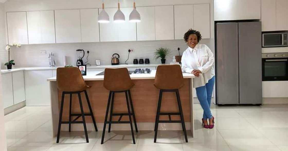 Young woman gifts mother beautiful house. Young woman gifts mother beautiful house.
