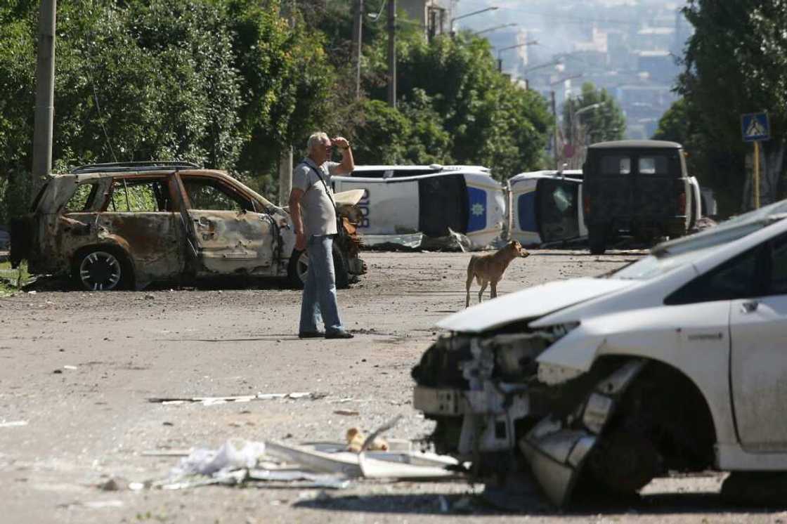 Police have dragged the wreckage of destroyed cars and vans into the streets to create a network of obstacles Police have dragged the wreckage of destroyed cars and vans into the streets to create a network of obstacles