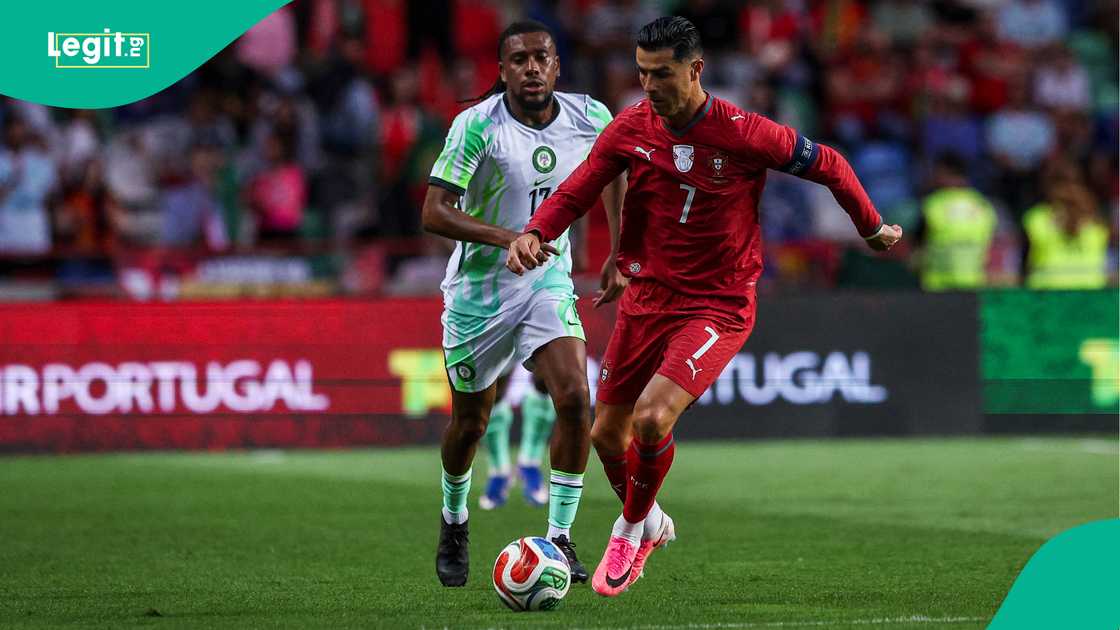 Alex Iwobi in action against Cristiano Ronaldo during his 100th match in Leiria, Portugal. Photo by Carlos Rodrigues