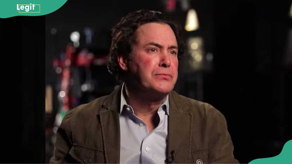 Barry Sherman sitting in a dimly lit setting Barry Sherman sitting in a dimly lit setting