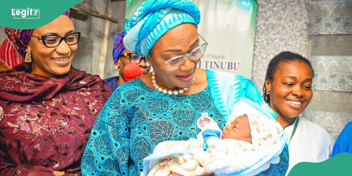 First Lady Oluremi Tinubu holding Abuja's first baby of the year First Lady Oluremi Tinubu holding Abuja's first baby of the year