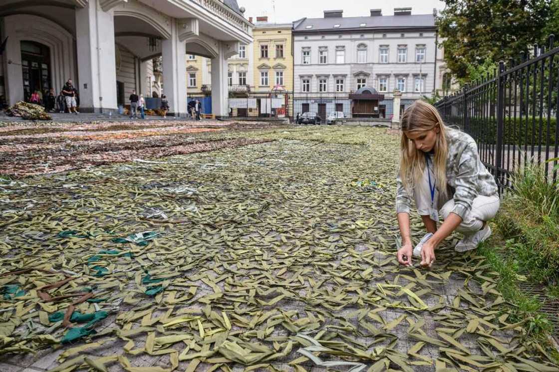 A woman makes camouflage nets for the Ukrainian military in Lviv A woman makes camouflage nets for the Ukrainian military in Lviv