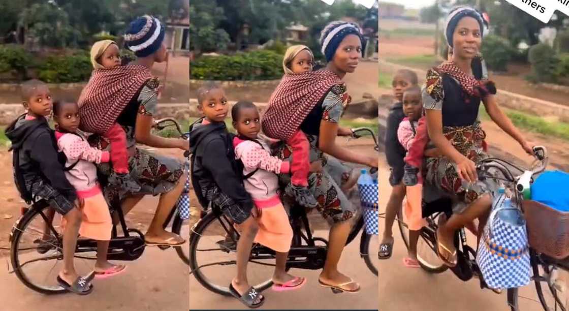 Photos of a mother carrying her 3 children on a bicycle. Photos of a mother carrying her 3 children on a bicycle.