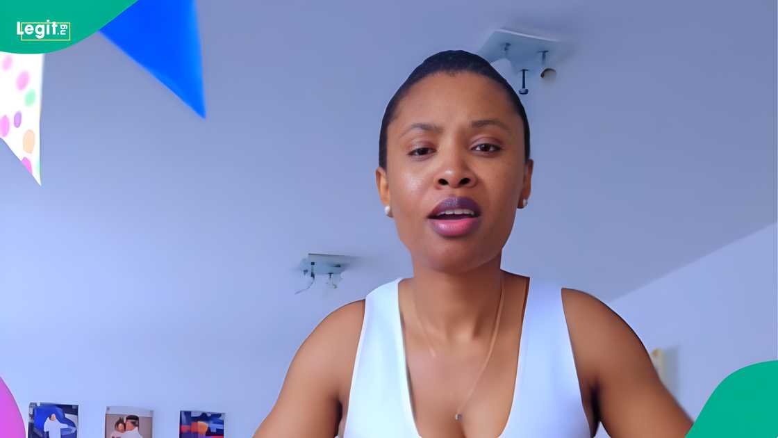 A mother reacts as she displays WhatsApp chat of her 12-year-old son