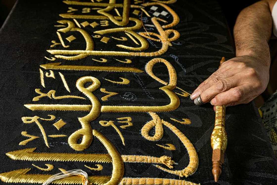From the 13th century, Egyptian artisans made the kiswa, the giant black cloth that covers the Kaaba in Mecca's Grand Mosque From the 13th century, Egyptian artisans made the kiswa, the giant black cloth that covers the Kaaba in Mecca's Grand Mosque