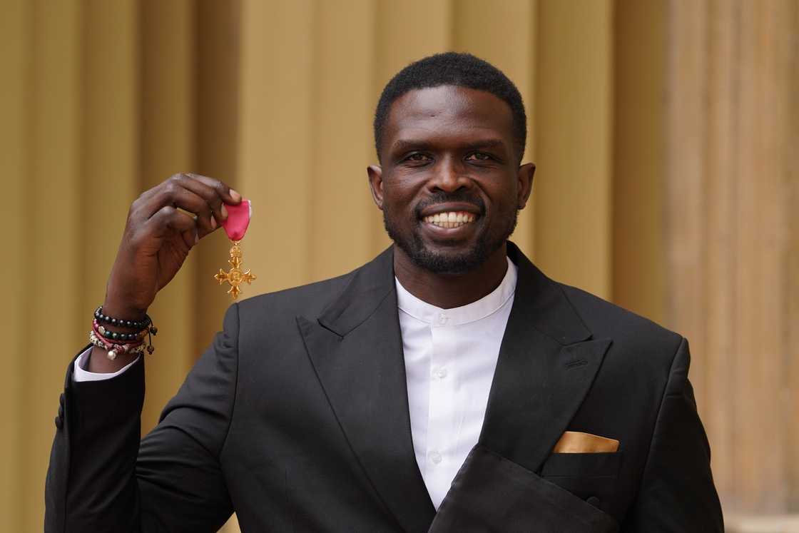 Luol Deng with his OBE (Officer of the Order of the British Empire) after an investiture ceremony at Buckingham Palace in London, England