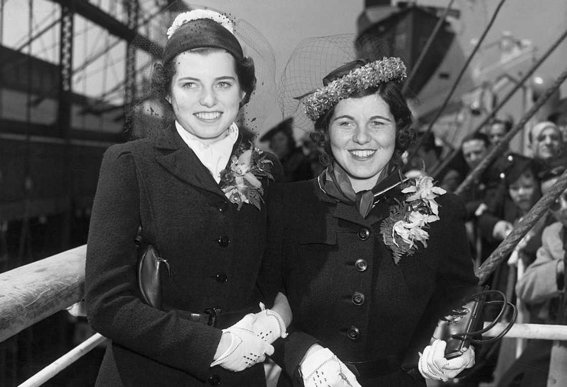 A black and white photo of Eunice (L) and Rosemary Kennedy (R) on board the S.S. Manhattan of the United States Lines ship