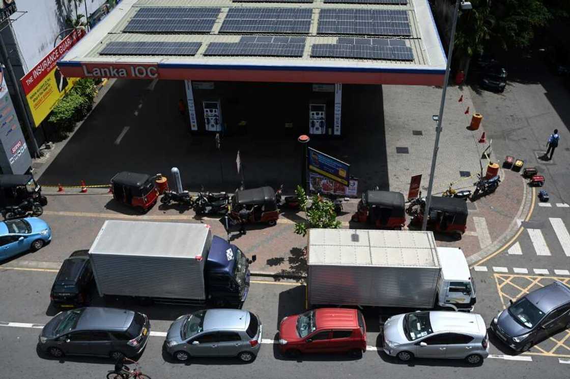 Even amid protests that saw the presidential residence stormed, many in Colombo refused to abandon their place in fuel queues Even amid protests that saw the presidential residence stormed, many in Colombo refused to abandon their place in fuel queues