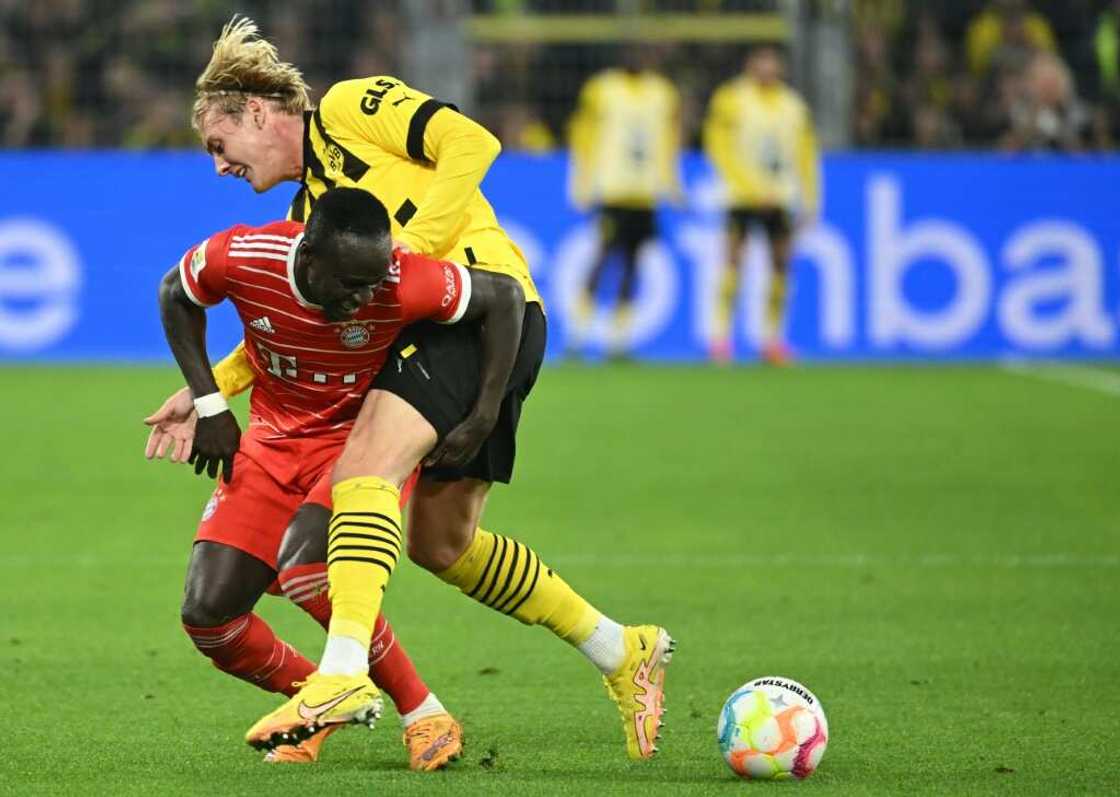 Bayern Munich star Sadio Mane (L) battles for possession against Borussia Dortmund. Bayern Munich star Sadio Mane (L) battles for possession against Borussia Dortmund.