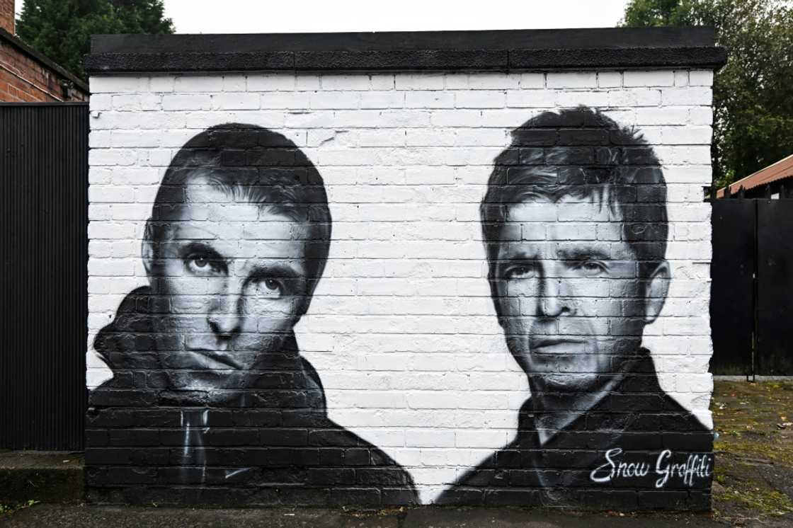 A mural by the artist known as Snow Graffiti of Liam and Noel Gallagher outside the Whitefield pub in Manchester, where they will play in July A mural by the artist known as Snow Graffiti of Liam and Noel Gallagher outside the Whitefield pub in Manchester, where they will play in July