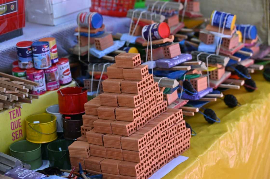 Miniature items for sale include bricks, paint and other construction materials