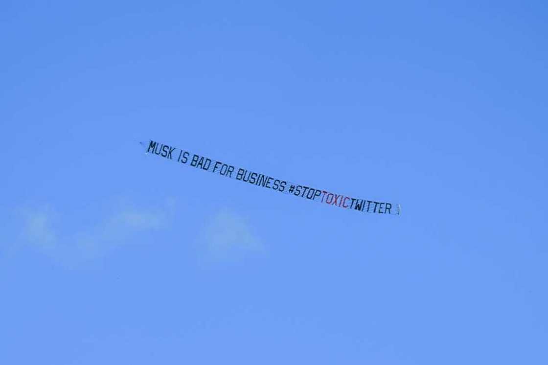 A banner reading, "Musk is Bad for Business #StopToxicTwitter" is flown over a conference venue in Miami, Florida where the Twitter CEO made a keynote address A banner reading, "Musk is Bad for Business #StopToxicTwitter" is flown over a conference venue in Miami, Florida where the Twitter CEO made a keynote address
